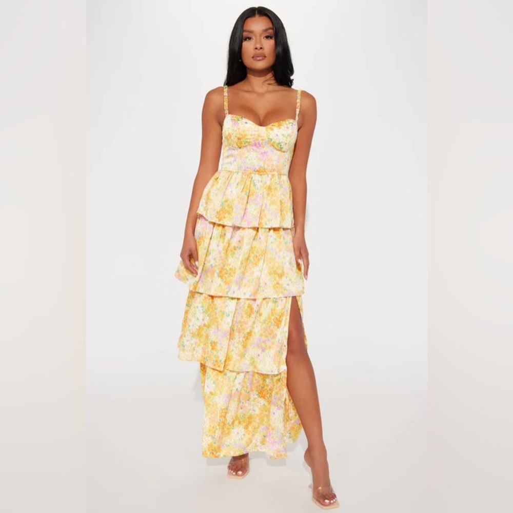 Fashion Nova yellow floral maxi dress with ruffles and a slit.